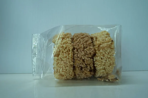 Khao Tan stacked together, packed in clear plastic wrap, popularly used as a snack