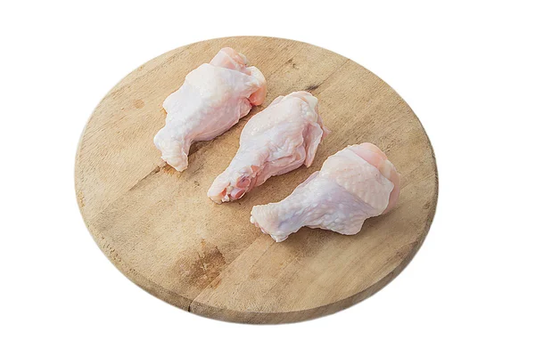 Raw chicken legs on wooden cutting boards on white background — Stock Photo, Image