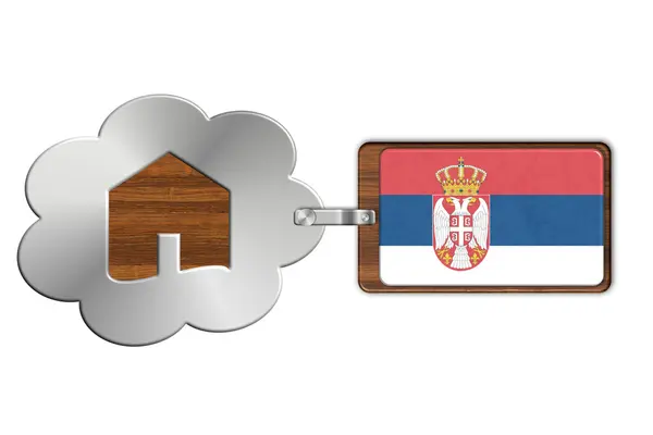 Chmura i domu wykonane ze stali i drewna z flaga Serbii — Zdjęcie stockowe