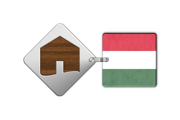 Symbolem domu wykonane ze stali i drewna z flagą Węgry — Zdjęcie stockowe