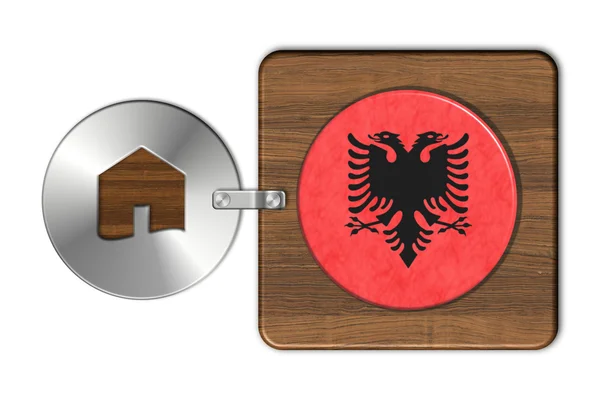 Home symbol made of steel and wood with Albania flag — Stock Photo, Image