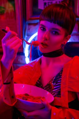 Girl in neon bar have fun