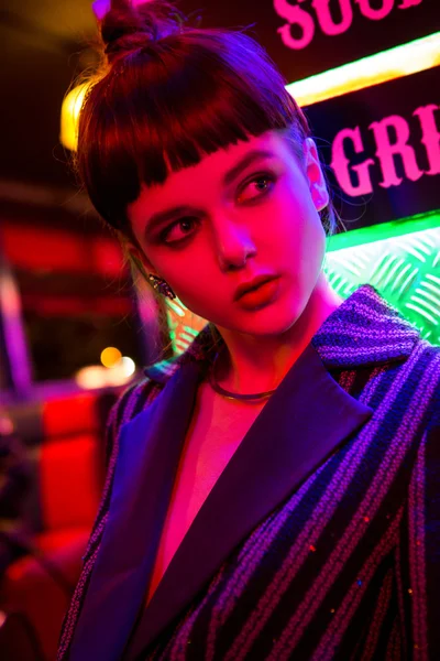 Girl in neon bar have fun