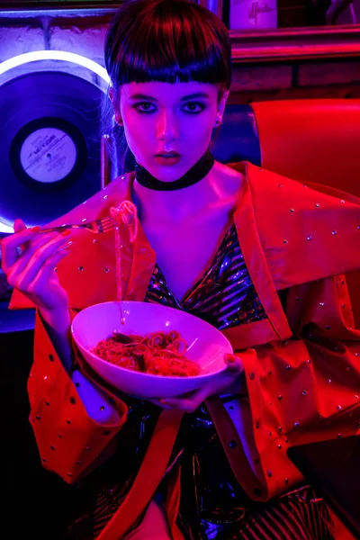 Girl in neon bar have fun