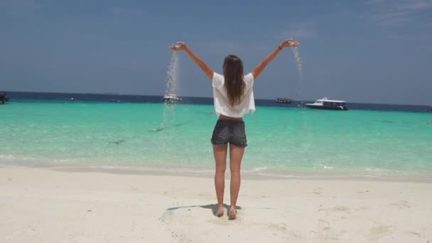 Woman Dropping Sand And Jumping — Stock Video