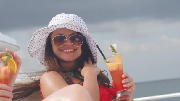 Girls on a yacht in sea with cocktails — Stock Video