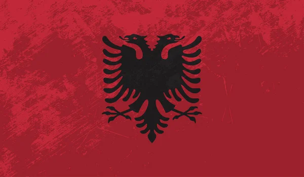 Arnavutluk bayrağı el sallayan grunge desenli. Vektör arkaplanı.