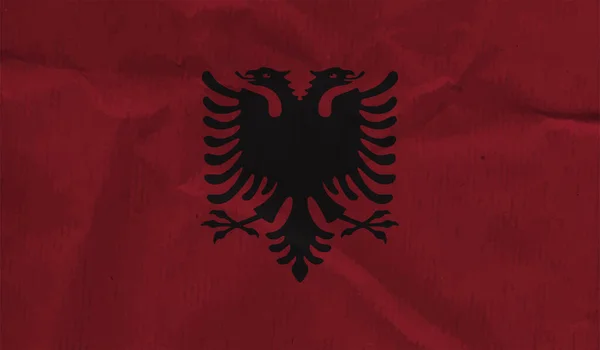 Albánská Vlajka Vlnící Grunge Texturou Pozadí Vektoru — Stockový vektor