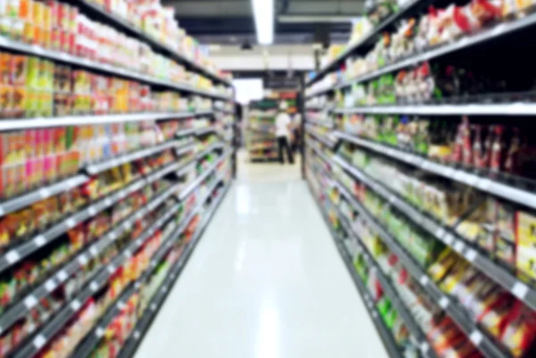 Supermarket obchod rozostření pozadí — Stock fotografie