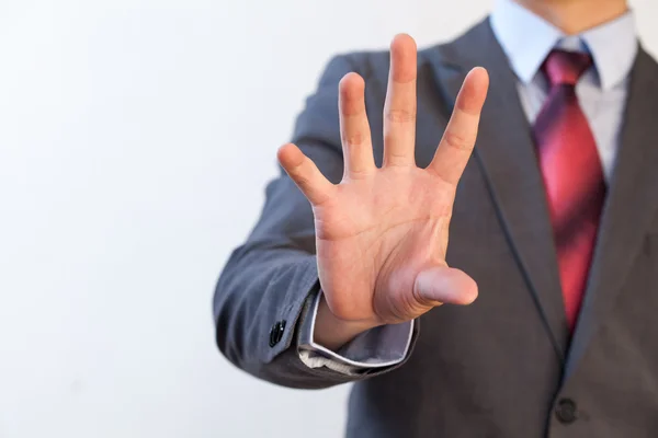 Empresário beliscando no ar com cinco dedos — Fotografia de Stock