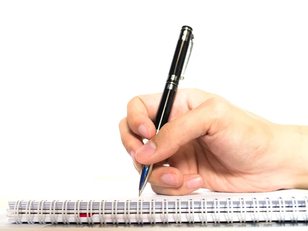 Mani con penna su taccuino isolato su sfondo bianco — Foto Stock