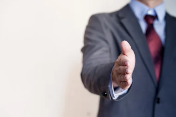 Business man reaching out hand to shake - Business Concept and Greeting — Stock Photo, Image