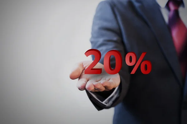Empresário apresentando 20 por cento gráfico na mão — Fotografia de Stock