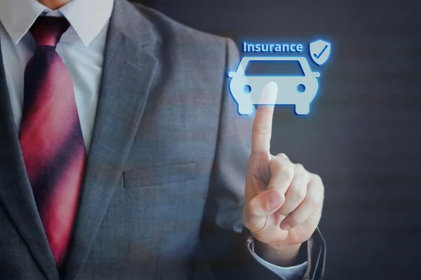 Businessman pressing insured car icon in the air with one finger - car insurance concept — Stock Photo, Image