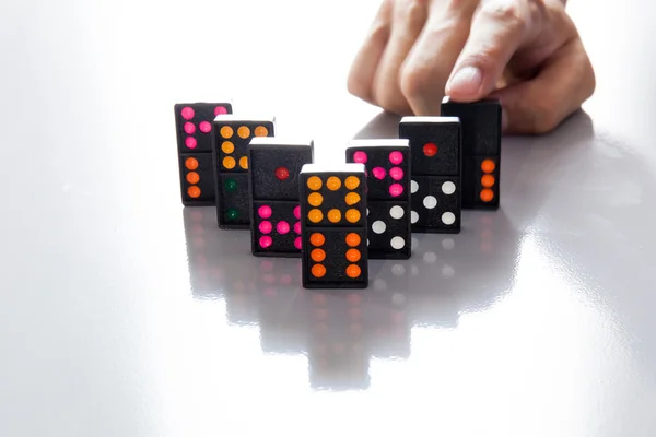 Man Hands playing domino on shiny desk — Stock Photo, Image