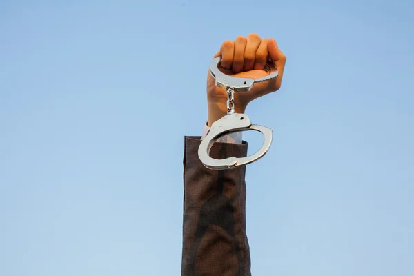Business man showing handcuffs after releasing it. — Stock Photo, Image