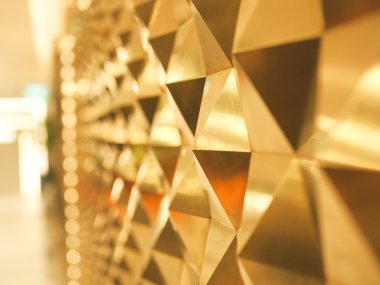 Solda bokeh ile Altın Sarı düşük poli geometrik soyut arka plan