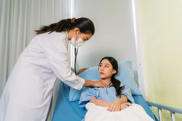 Doctor checking patient with stethoscope