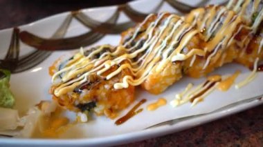 Top view of California sushi roll served on the plate