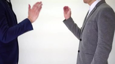 Successful businessmen shake hands isolated on white background