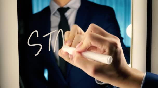 Smart business man writing the word Start-up on the mirror board — Αρχείο Βίντεο