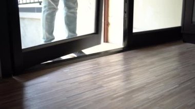 Close up of one persons feet walking inside the house without taking shoes off