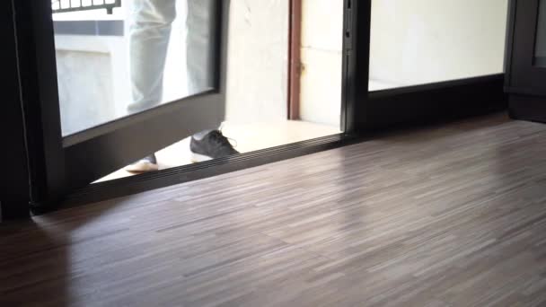 Close up of one persons feet walking inside the house without taking shoes off — Αρχείο Βίντεο