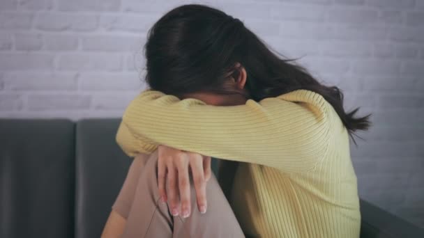 Depressed and desperate woman crying and feeling sad at home — Stock Video