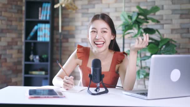 Cheerful blogger using mic for podcast — Stock Video