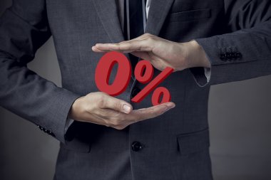 Business man Presenting Zero Percent, indicating zero interest clipart