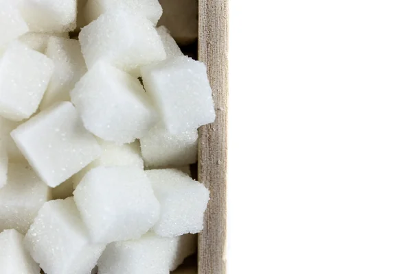 Vista aérea de los cubos de azúcar en forma de cuenco cuadrado sobre fondo blanco aislado — Foto de Stock
