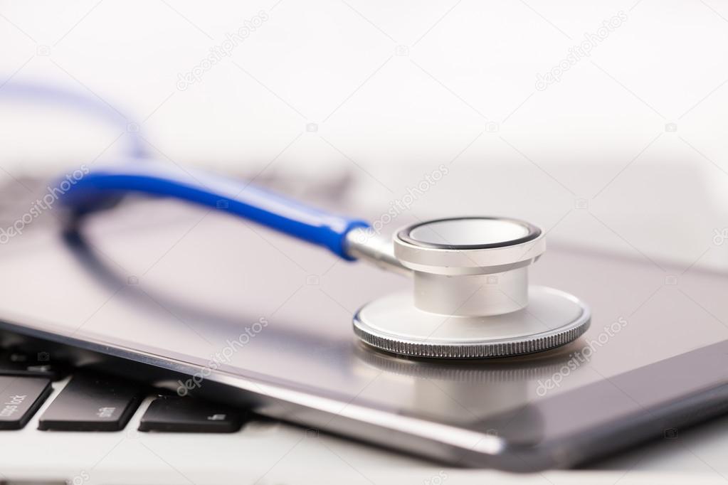 Tablet / Phablet being diagnosed by stethoscope - phone repair and check up concept