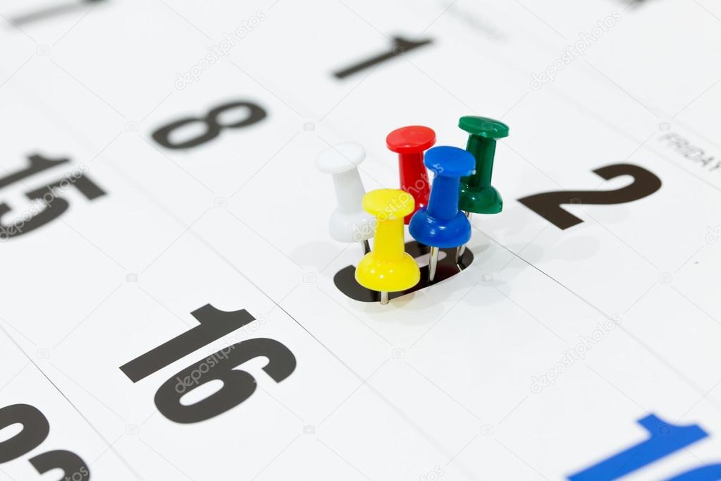 Pushpins on calendar, Busy and overworking days. Important date 