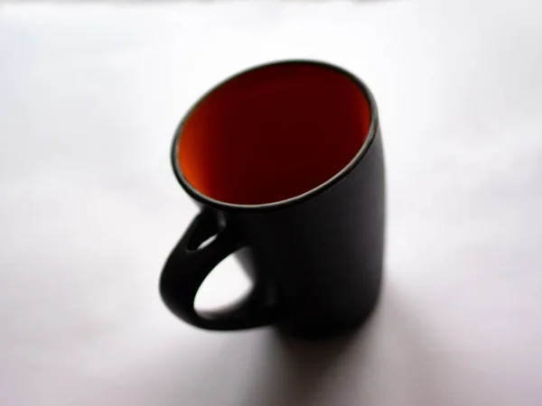 Czarna Filiżanka Pomarańczy Wewnątrz Kawę Herbatę Mleko Sok Przytulny Stan — Zdjęcie stockowe