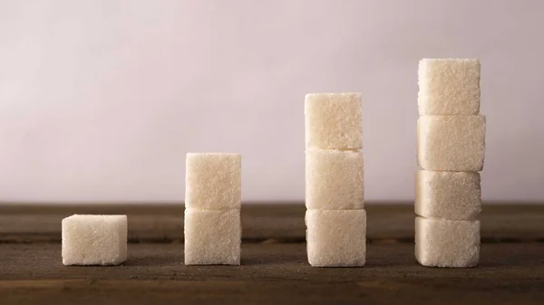 Reduce Sugar Concept. Sugar Cubes In Declining Chart