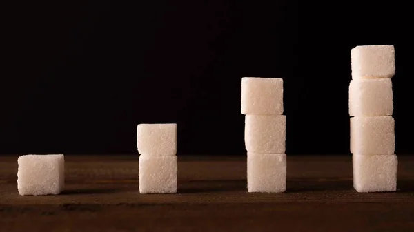 Reduce Sugar Concept. Sugar Cubes In Declining Chart