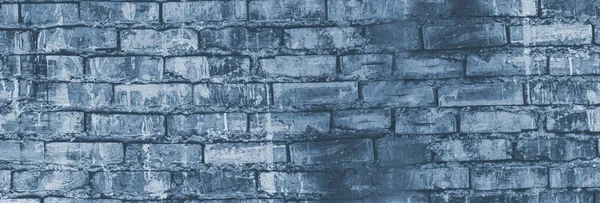 brick grunge background. an old brick wall. A dark gray stone wall. Crumbling brickwork. A weathered stone wall.