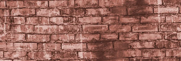 brick grunge background. an old brick wall. A dark gray stone wall. Crumbling brickwork. A weathered stone wall.