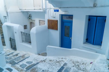 Mykonos Town, Greece - October 19, 2020 - typical white-blue Cycladic house clipart