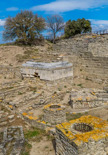 Vertical view of ancient ruins and wells in the landmark site of the ancient city of Troy near Canakkale, Turkey