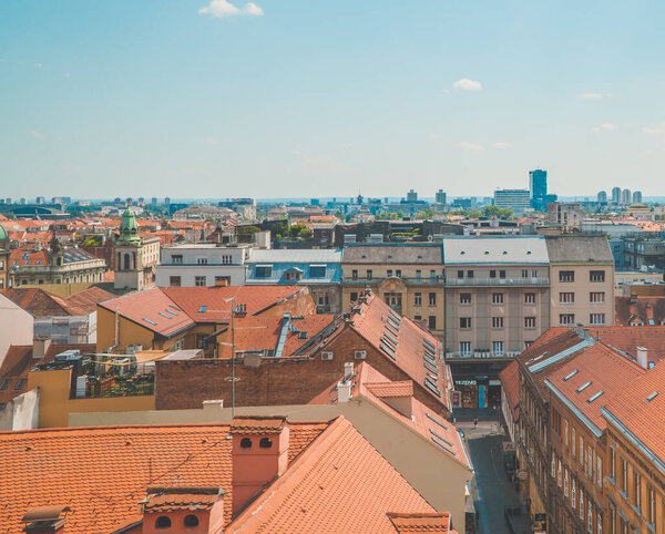 Zagreb, Croatia - June 28, 2020 - panoramic daylight view of the city from the Upper Town with traditional architecture and socialist residential towers in the background