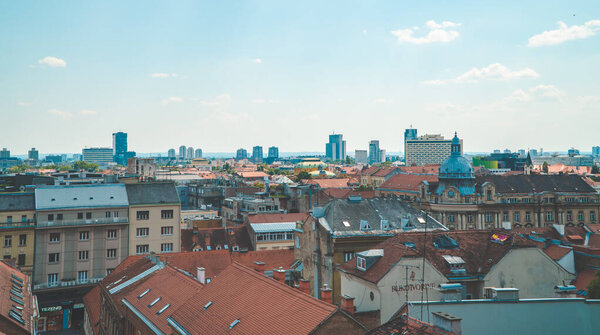 Zagreb, Croatia - June 28, 2020 - panoramic horizontal daylight view of the city from the Upper Town with socialist residential towers in the background