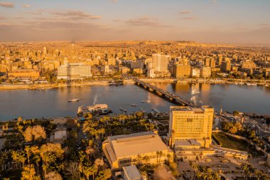 Cairo, Egypt - March 25, 2021 - beautiful aerial panorama view of luxury hotels on the Nile with Cairo Skyline in the background at dusk