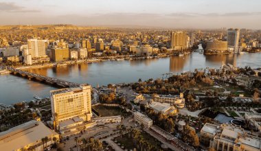 Cairo, Egypt - March 25, 2021 - beautiful aerial panorama view of luxury hotels on the Nile with Cairo Skyline in the background at sunset