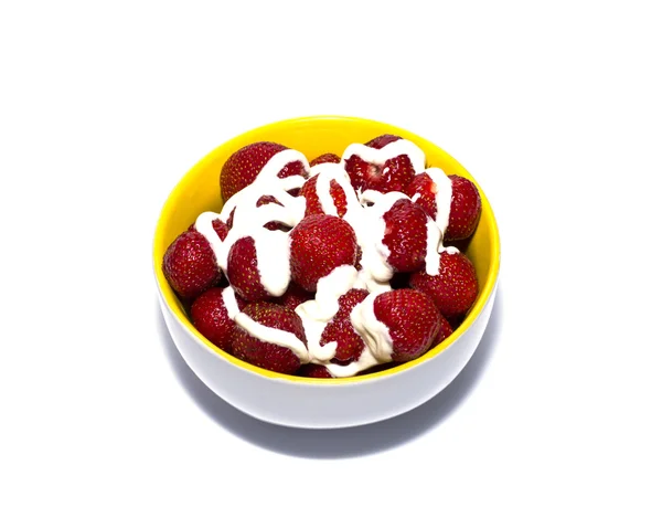 Strawberry with cream in a yellow plate — Stock Photo, Image