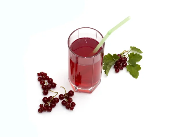 The glass of juice decorated with currant branches — Stock Photo, Image