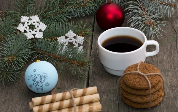 still life a fir-tree branch with jewelry, two linking of cookie