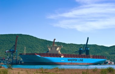 Container ship Marstal Maersk at the pier terminal. Nakhodka Bay. East (Japan) Sea. 30.05.2014 clipart