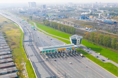Top view aerial overloaded toll road or tollway on the controlled access highway, forced traffic jam clipart