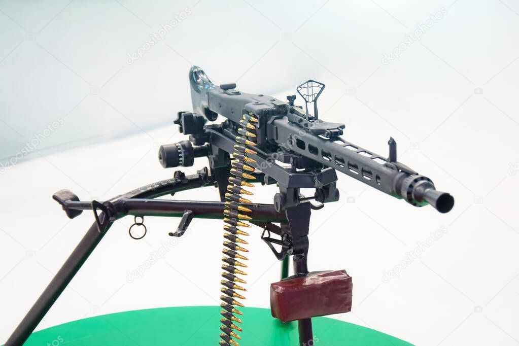 Black machine gun with chain of cartridges